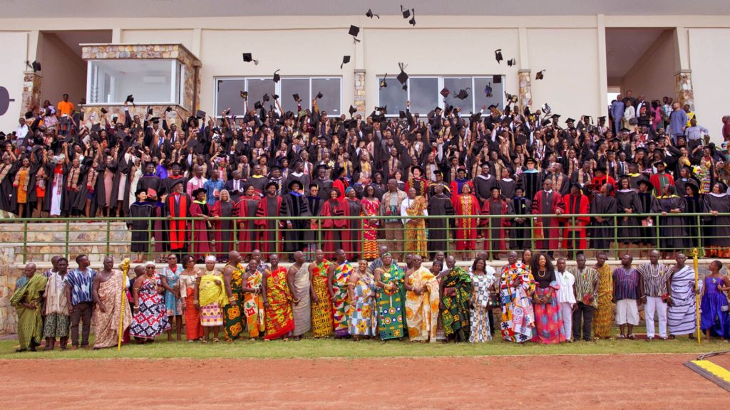 Ashesi graduates tossing caps